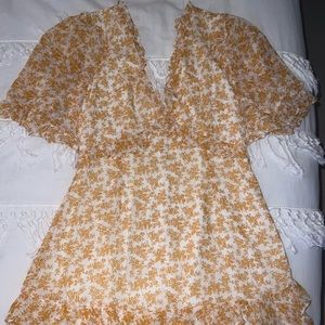 Yellow floral dress. Open keyhole back.